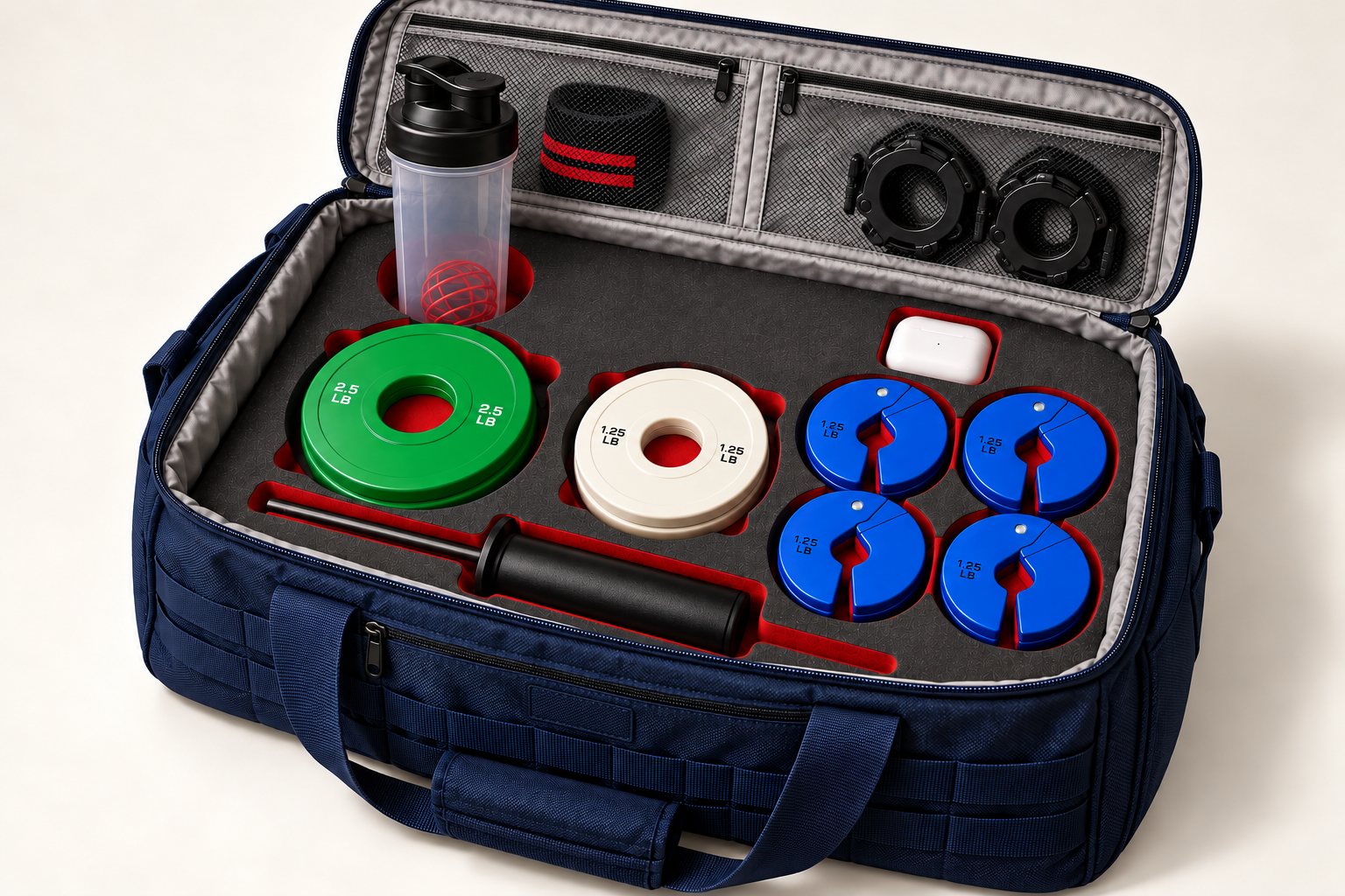 Concept image: navy KITFORM bag open on a white background. Graphite foam with red cutouts holds 2.5 lb and 1.25 lb change plates, a loading pin, four blue micro plates, an earbuds case and a shaker, with wrist wraps and collars in the lid pockets